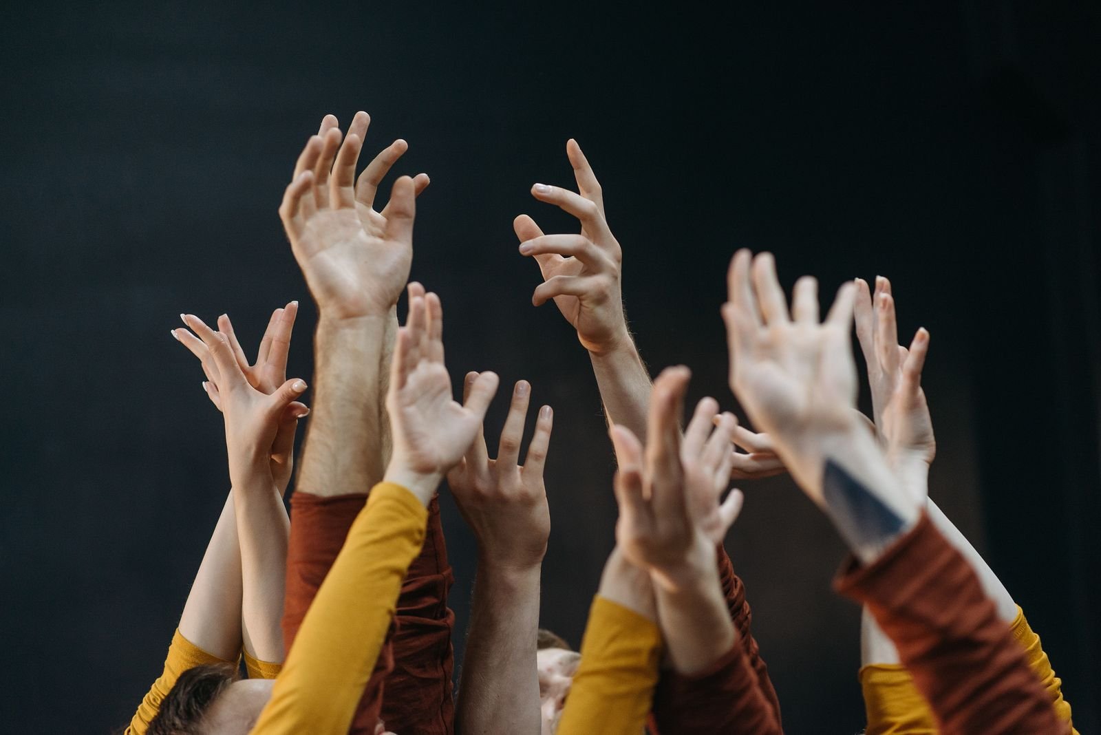 Hands raised in worship at City of Joy